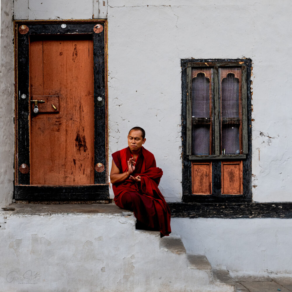 "Monk Sitting on Steps"
